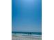 Scenic view of a beach with gentle waves and clear blue sky at 701 S Madison Ave # 414, Clearwater, FL 33756