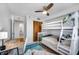 Bright bedroom featuring bunk beds, a desk, and closet at 701 S Madison Ave # 414, Clearwater, FL 33756