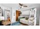 Bright bedroom featuring bunk beds, desk, closet and view of the bathroom at 701 S Madison Ave # 414, Clearwater, FL 33756