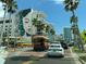 Scenic street view with trolley car and mural-covered building at 701 S Madison Ave # 414, Clearwater, FL 33756