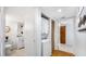 Hallway with the laundry center next to a bathroom at 701 S Madison Ave # 414, Clearwater, FL 33756