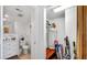 Hallway view with storage closet, and a partial view of the bathroom at 701 S Madison Ave # 414, Clearwater, FL 33756