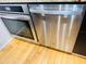 Stainless steel dishwasher and oven add a modern touch to this kitchen's functionality at 701 S Madison Ave # 414, Clearwater, FL 33756