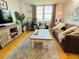 A cozy living room with a large window and neutral-toned decor at 701 S Madison Ave # 414, Clearwater, FL 33756