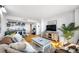 Bright living room with open floor plan featuring hardwood floors and an eat-in kitchen at 701 S Madison Ave # 414, Clearwater, FL 33756