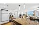 A bright open floor plan with a large kitchen counter and stainless steel appliances at 701 S Madison Ave # 414, Clearwater, FL 33756