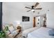 The bedroom includes a cozy sitting area, ceiling fan and a TV for relaxing at 701 S Madison Ave # 414, Clearwater, FL 33756