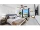 Bright main bedroom features a comfortable bed, modern decor, and natural light at 701 S Madison Ave # 414, Clearwater, FL 33756