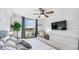 Bright primary bedroom with a large window, a ceiling fan and neutral decor at 701 S Madison Ave # 414, Clearwater, FL 33756