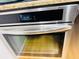 Close-up of a stainless steel oven featuring easy-to-use digital controls at 701 S Madison Ave # 414, Clearwater, FL 33756