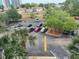 Well-maintained parking lot surrounded by lush, mature landscaping at 701 S Madison Ave # 414, Clearwater, FL 33756