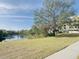 Scenic view of a pond reflecting the sky and surrounding foliage and building at 701 S Madison Ave # 414, Clearwater, FL 33756