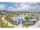 Beautiful aerial view of community pool, clubhouse, and lakefront homes at 7236 Sutton Ln, Sarasota, FL 34240