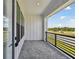 Outdoor patio with pavers, dark metal railings, and neighborhood views at 7236 Sutton Ln, Sarasota, FL 34240