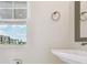 Bright bathroom features a modern vanity and natural light streaming through the window at 7236 Sutton Ln, Sarasota, FL 34240