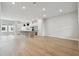 Expansive living area with a modern kitchen, hardwood floors, and plenty of natural light at 7236 Sutton Ln, Sarasota, FL 34240