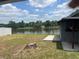 Backyard overlooking a pond, showcasing a serene outdoor space at 7401 N Albany Ave, Tampa, FL 33604