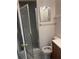 Bathroom with glass shower, toilet, and vanity at 7401 N Albany Ave, Tampa, FL 33604