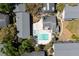 Aerial view of neighborhood showing pool, clubhouse, buildings, and trees at 7505 Pitch Pine Cir # 122, Tampa, FL 33617