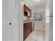 Efficient kitchen layout featuring ample cabinet space, stainless steel appliances, and a window view at 7505 Pitch Pine Cir # 122, Tampa, FL 33617