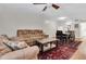 Spacious living room, dining area combo featuring hardwood floors, and contemporary furnishings at 7505 Pitch Pine Cir # 122, Tampa, FL 33617