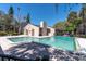 Community pool with cool water, next to clubhouse and neighborhood landscape at 7505 Pitch Pine Cir # 122, Tampa, FL 33617