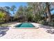 Community pool with cool water, fenced in, and neighborhood landscape at 7505 Pitch Pine Cir # 122, Tampa, FL 33617