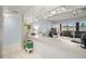 Bright living room with a breakfast bar, tiled floor and access to outdoor patio at 7701 Starkey Rd # 443, Seminole, FL 33777