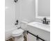 Well-lit bathroom featuring a tub and shower combination and black hardware at 8107 N 11Th St, Tampa, FL 33604