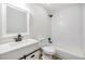 Well-lit bathroom featuring a tub and shower combination and black hardware at 8107 N 11Th St, Tampa, FL 33604