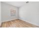 Bright bedroom with new paint, modern flooring and a window letting in natural light at 8107 N 11Th St, Tampa, FL 33604