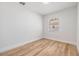 Bright bedroom with new paint, modern flooring and window letting in natural light at 8107 N 11Th St, Tampa, FL 33604