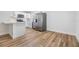 Updated kitchen with white cabinets and stainless steel appliances at 8107 N 11Th St, Tampa, FL 33604
