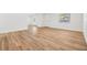 Well-lit living room with windows, and wood-look floors at 8107 N 11Th St, Tampa, FL 33604