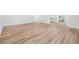Open concept living room with wood-look flooring at 8107 N 11Th St, Tampa, FL 33604