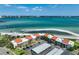 Stunning aerial view of a beachfront condo complex with beautiful ocean views and ample parking at 865 S Gulfview Blvd # 308, Clearwater, FL 33767