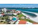 Aerial view of a large complex with beachfront access, pool, and manicured grounds at 865 S Gulfview Blvd # 308, Clearwater, FL 33767