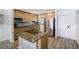 Modern kitchen with granite countertops, stainless steel appliances, and a center island at 865 S Gulfview Blvd # 308, Clearwater, FL 33767