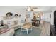 Open concept living space with kitchen access, bar seating, and modern decor at 865 S Gulfview Blvd # 308, Clearwater, FL 33767