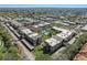 An aerial view of the Cordova Greens community featuring a swimming pool and nearby parking at 8703 Bardmoor Blvd # 305, Seminole, FL 33777