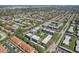 Wide aerial view of the community complex and landscaped lawns within a mature neighborhood at 8703 Bardmoor Blvd # 305, Seminole, FL 33777