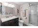 Bathroom with a stand-up shower, modern vanity, and beach themed decor at 8703 Bardmoor Blvd # 305, Seminole, FL 33777