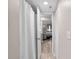 Bright bathroom featuring a shower with white curtain and an open door into the bedroom at 8703 Bardmoor Blvd # 305, Seminole, FL 33777
