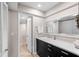 Bathroom with a long vanity, a large mirror and an open view to the toilet and shower at 8703 Bardmoor Blvd # 305, Seminole, FL 33777