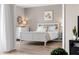 Bright and airy bedroom with white furniture, hardwood flooring, and soft natural light at 8703 Bardmoor Blvd # 305, Seminole, FL 33777