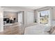 Bright bedroom with a queen bed and sliding glass doors to living area at 8703 Bardmoor Blvd # 305, Seminole, FL 33777