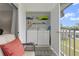Balcony laundry closet featuring a stacked washer and dryer for added convenience at 8703 Bardmoor Blvd # 305, Seminole, FL 33777