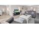 Open concept living room with modern decor and an open concept to the dining area at 8703 Bardmoor Blvd # 305, Seminole, FL 33777