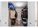Walk-in closet with shelving, wood floor, and ample storage space for clothes and accessories at 8703 Bardmoor Blvd # 305, Seminole, FL 33777