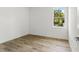 Bright bedroom featuring a window for natural light and wood floors at 8906 N Otis Ave, Tampa, FL 33604